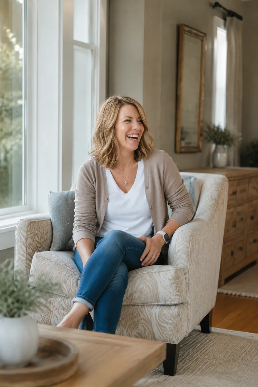 Maureen laughing in her living room
